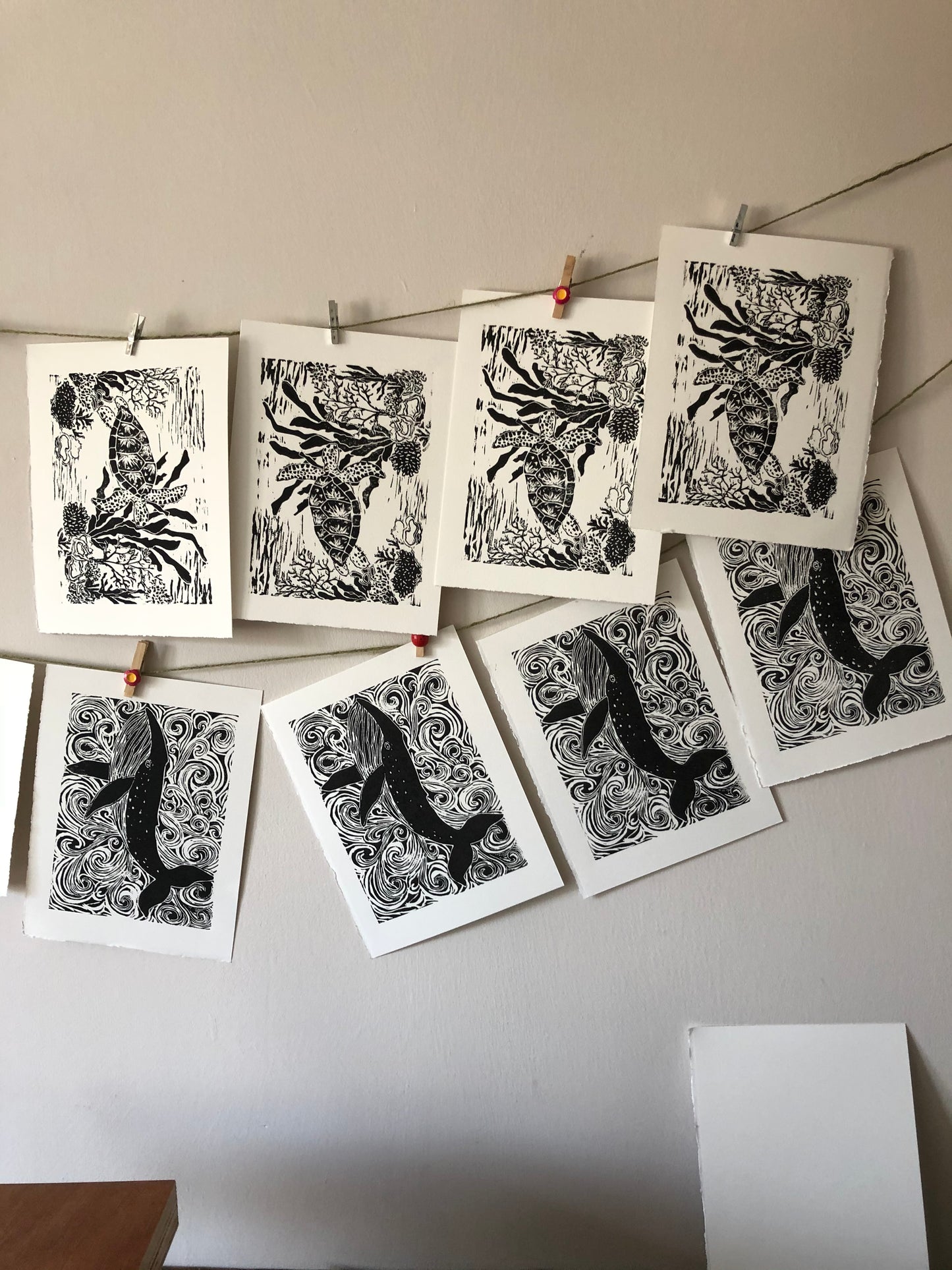 Original Linocut print of ‘Blue Whale & swirls’.