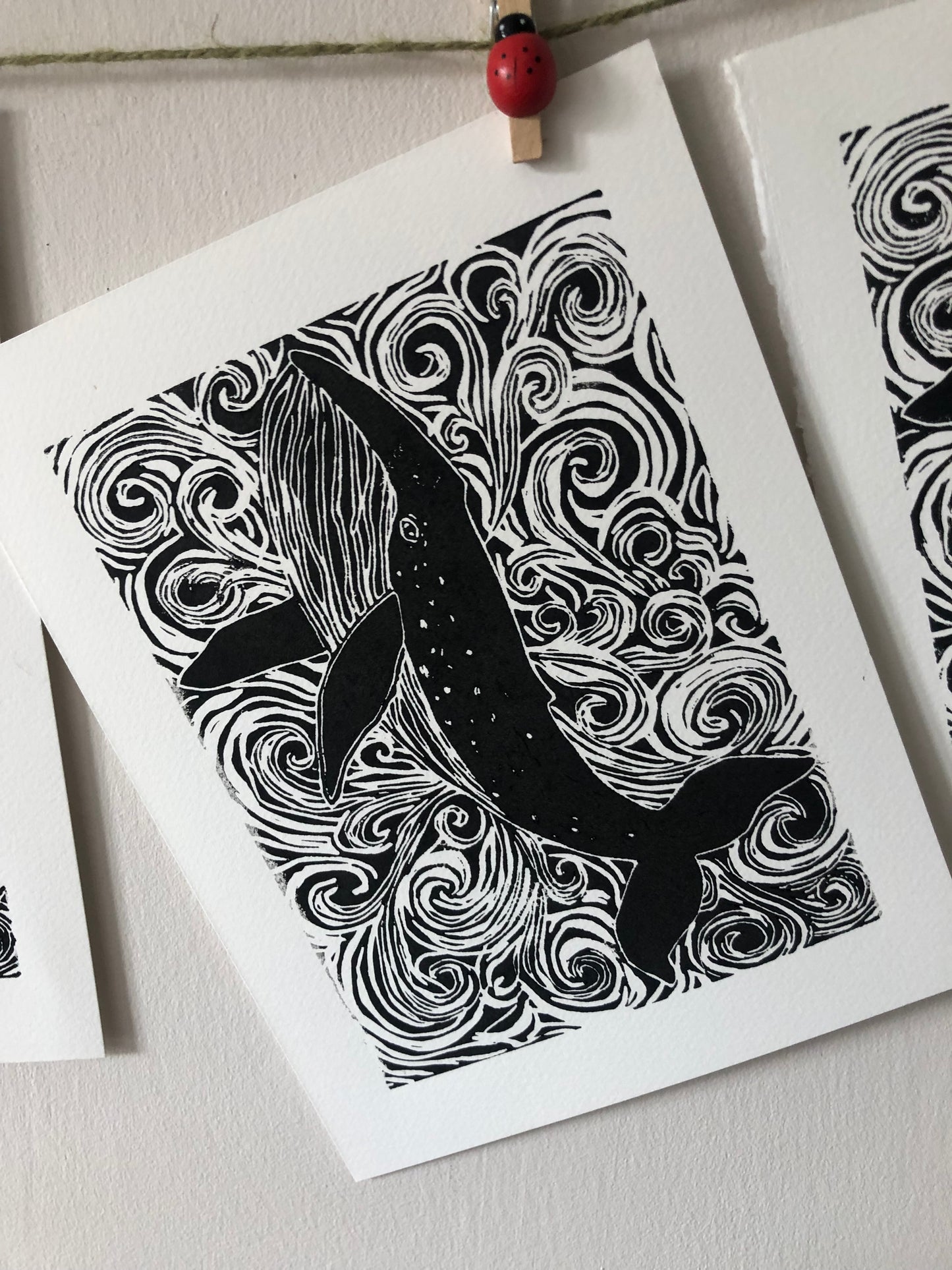 Original Linocut print of ‘Blue Whale & swirls’.