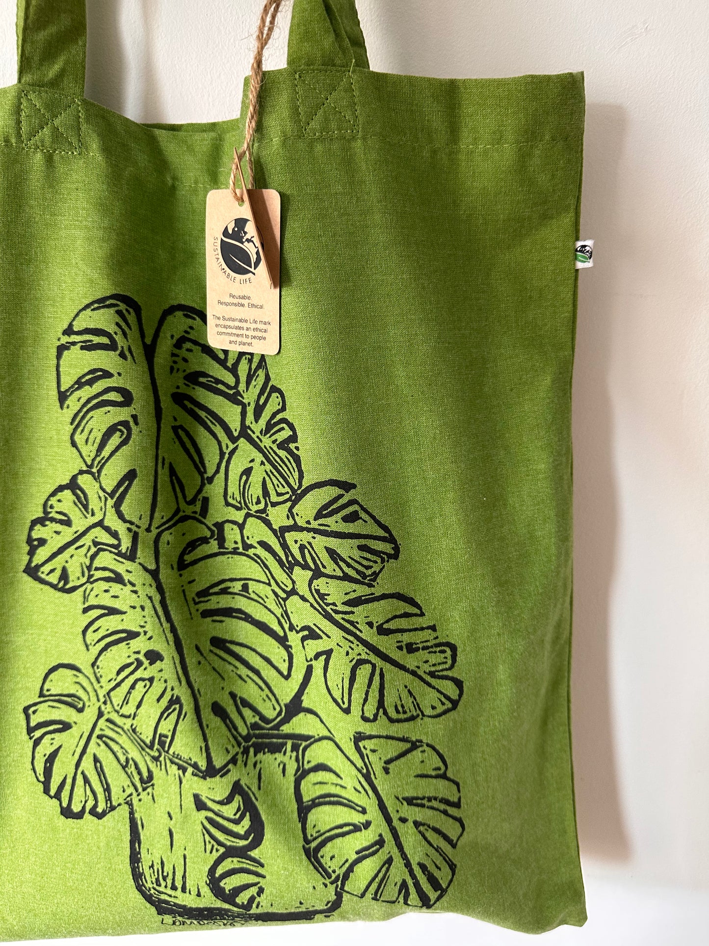 Eco-Friendly recycled plastic RPET Monstera Deliciosa tote bag.