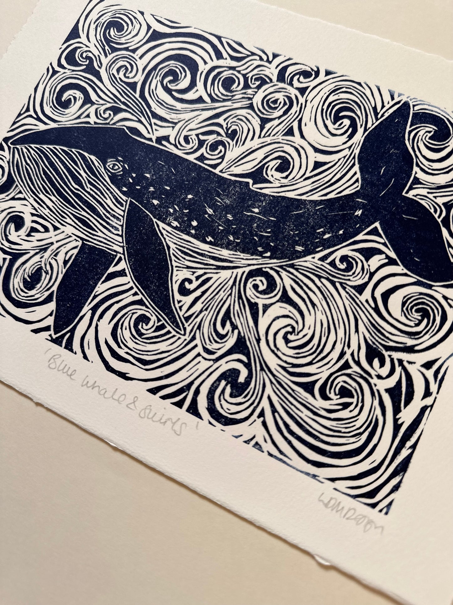 Original Linocut print of ‘Blue Whale & swirls’.