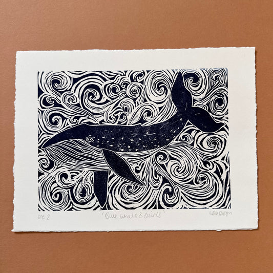 Original Linocut print of ‘Blue Whale & swirls’.