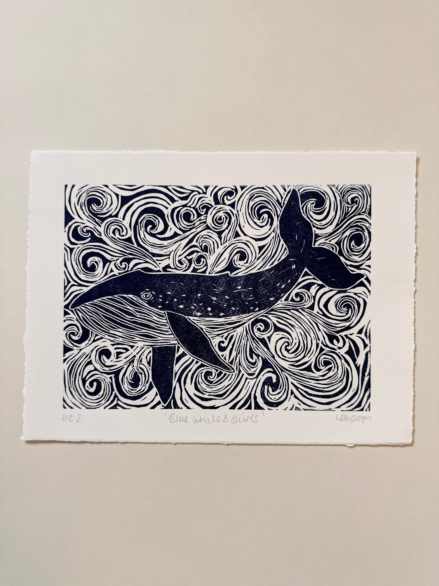 Original Linocut print of ‘Blue Whale & swirls’.